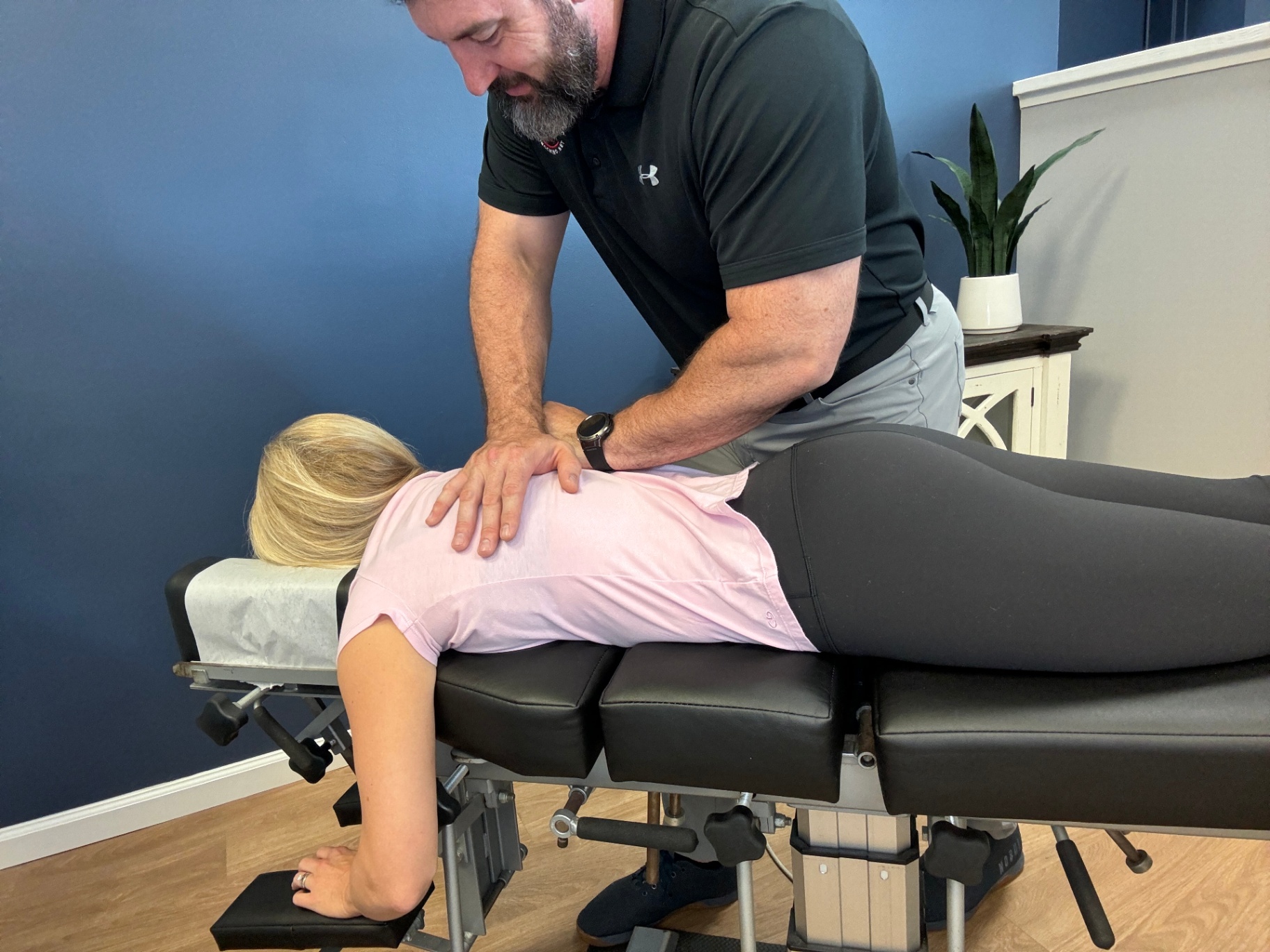 Dr. King performing a low-back adjustment