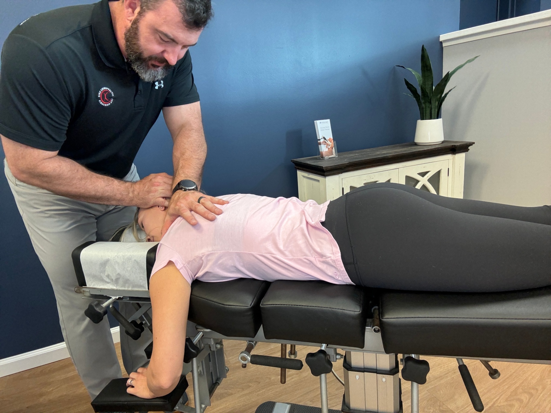 Dr. King performing a neck adjustment