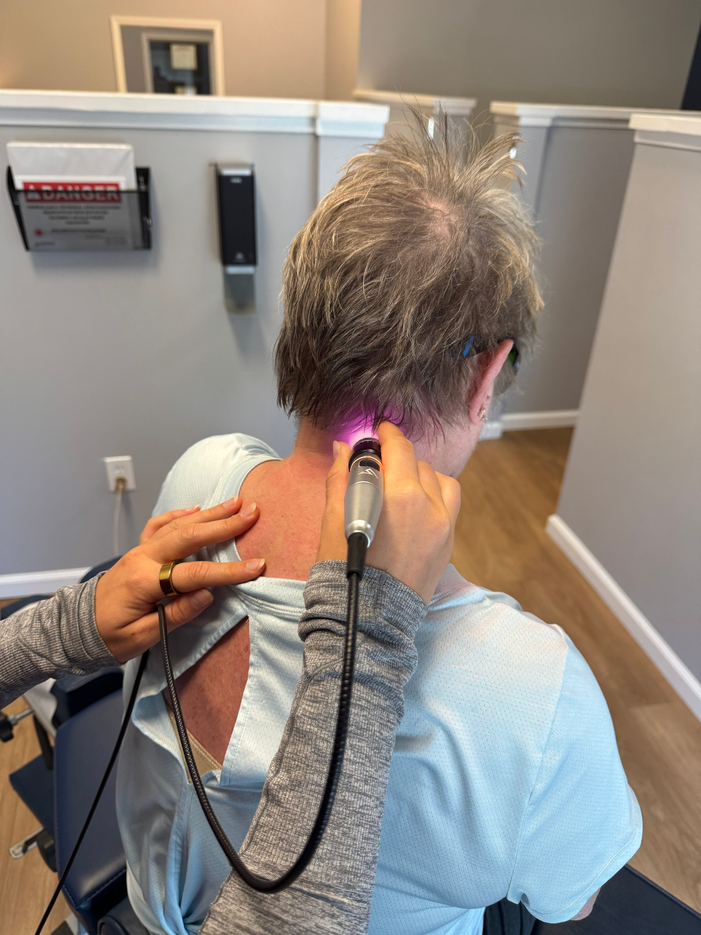Laser therapy on a patient's neck