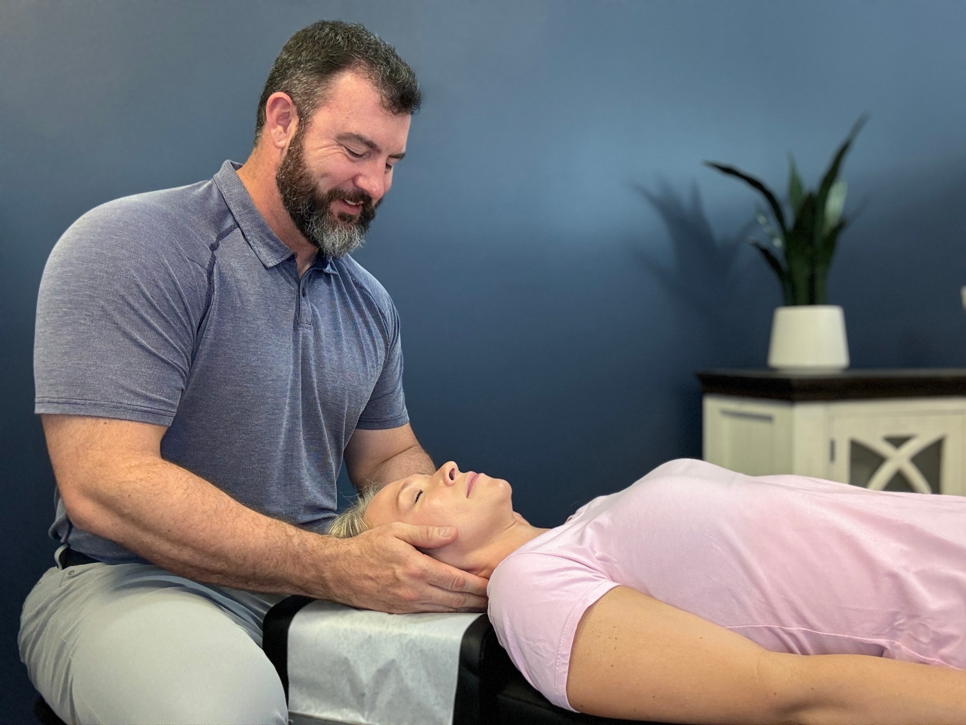 Dr. King performing a cervical adjustment