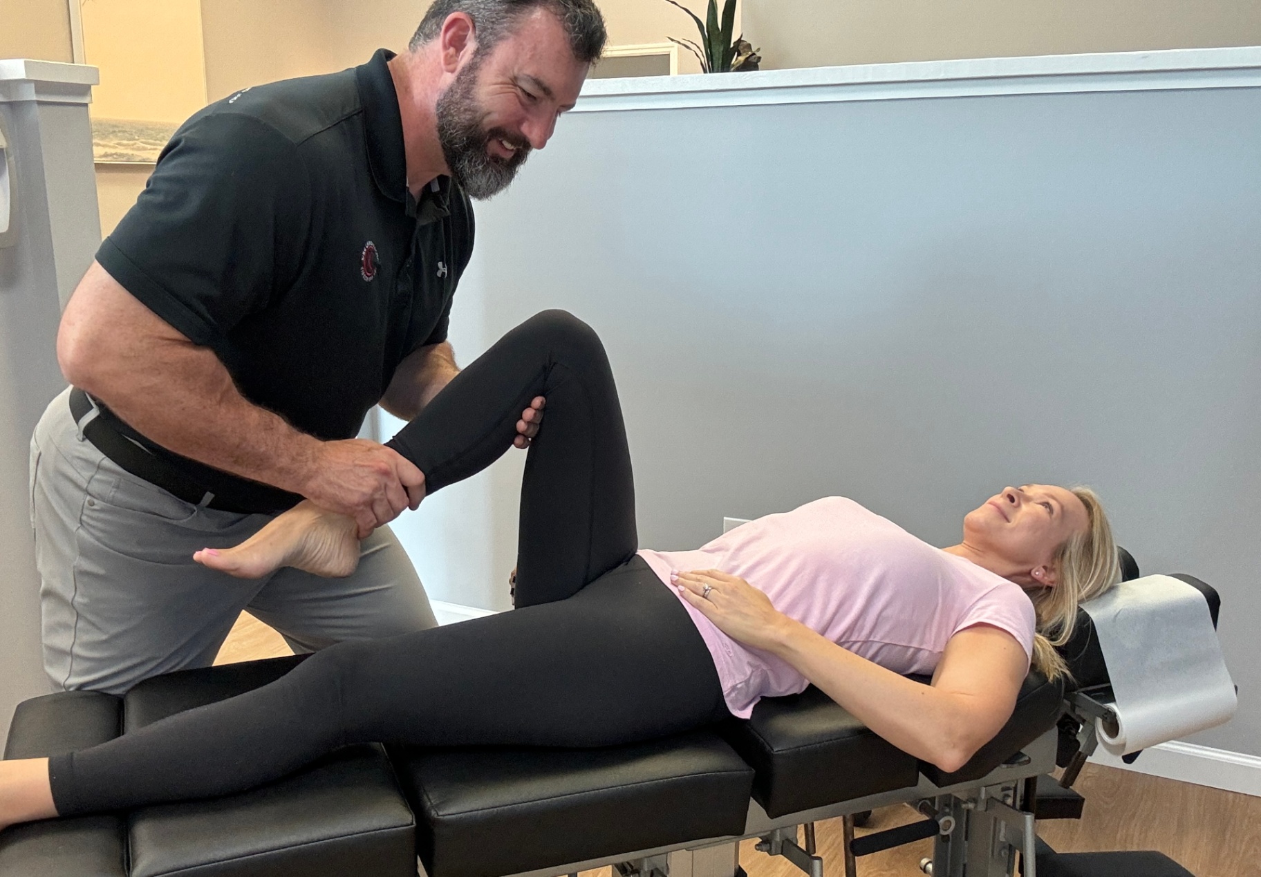 Dr. King guiding a hip stretch
