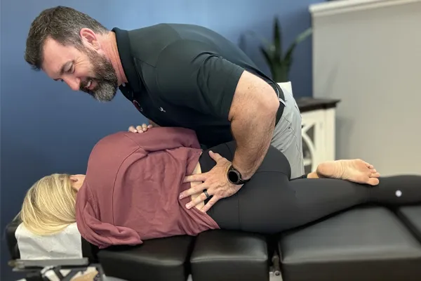 Chiropractor Wilmington NC Rhett King Adjusting Patient Back
