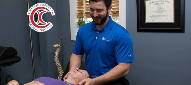 Chiropractor Wilmington NC Rhett King Adjusting Patient Neck